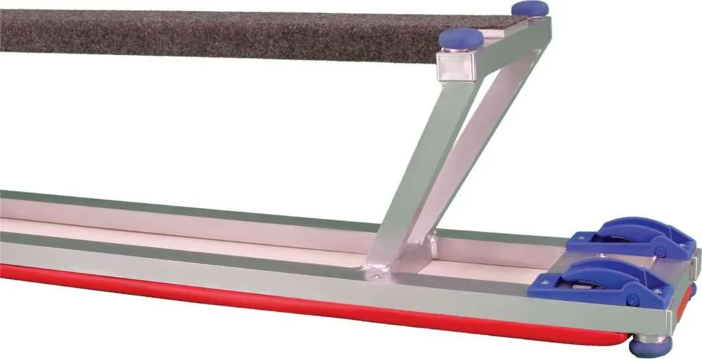 Aluminium bench frame with upholstered top, red rubber edging, blue caster locks and rubber feet.