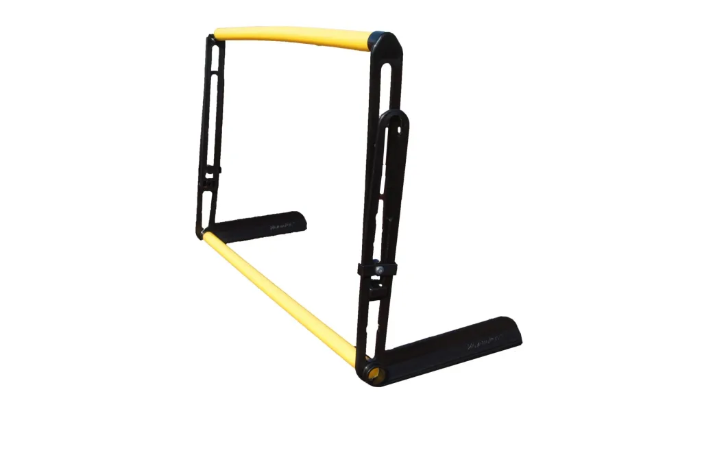 Black adjustable training hurdle with a yellow padded top and yellow base bar and black feet, showing the upright frame with height adjustment slots.