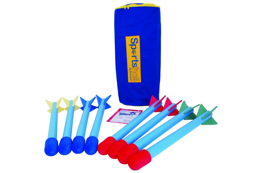 Set of foam bull nosed javelins with light-blue shafts, blue and red weighted noses and yellow, blue, red, and green fins, in front of a blue zippered bag.