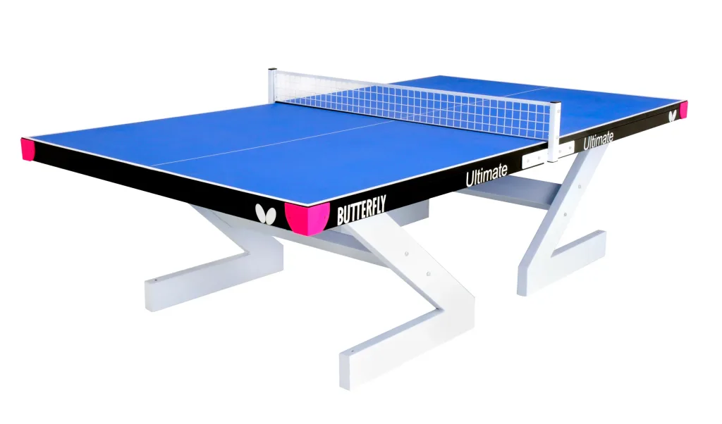 Blue outdoor table tennis table with steel frame, magenta corner protectors, light silver Z-shaped legs and a silver aluminium net.