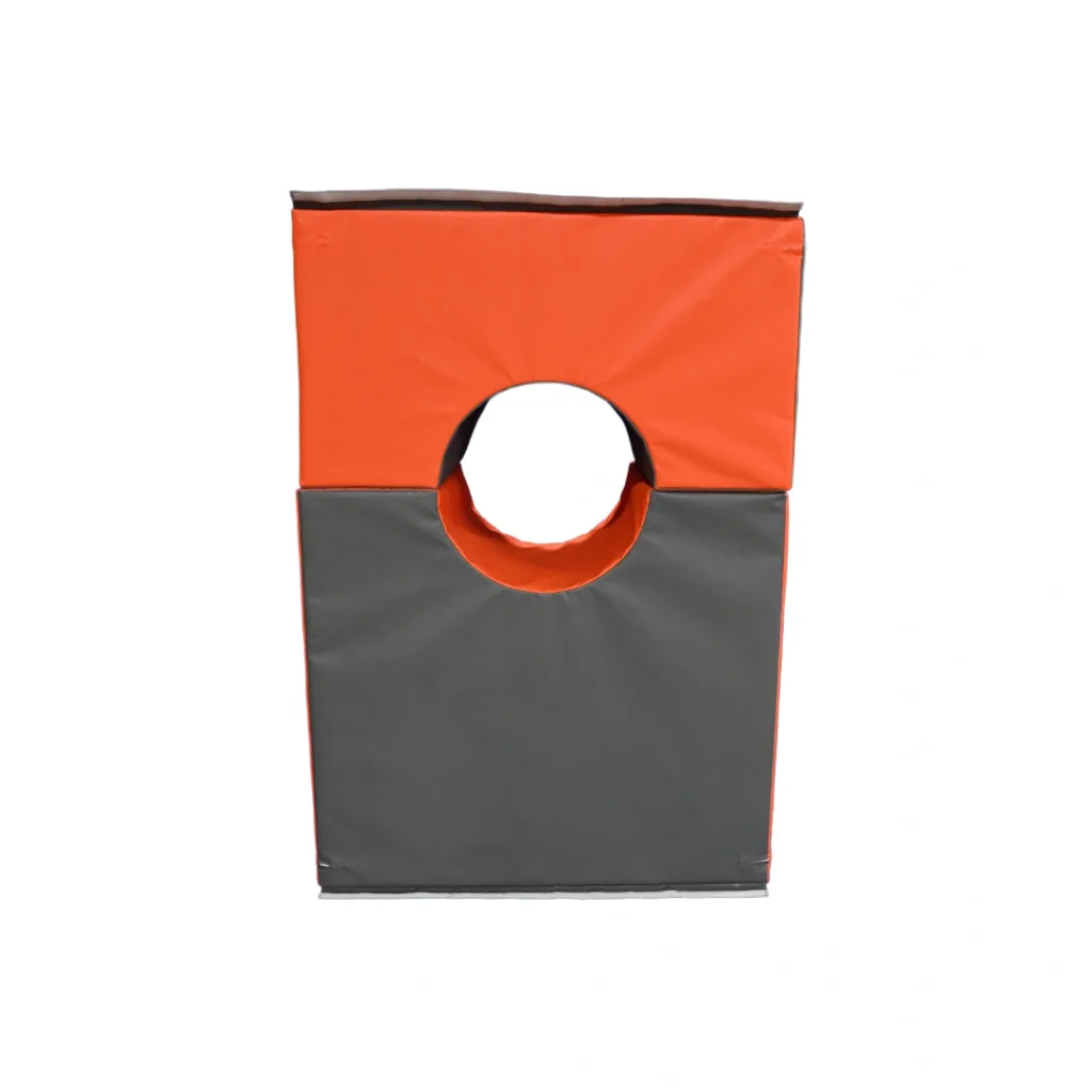 Stacked orange and grey foam gymnastics play pieces forming a rectangle with a centered circular hole.