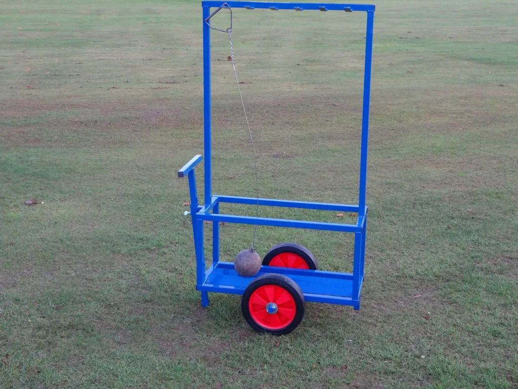 Blue powder-coated steel hammer trolley with large hard rubber wheels and one hanging hammer on grass.