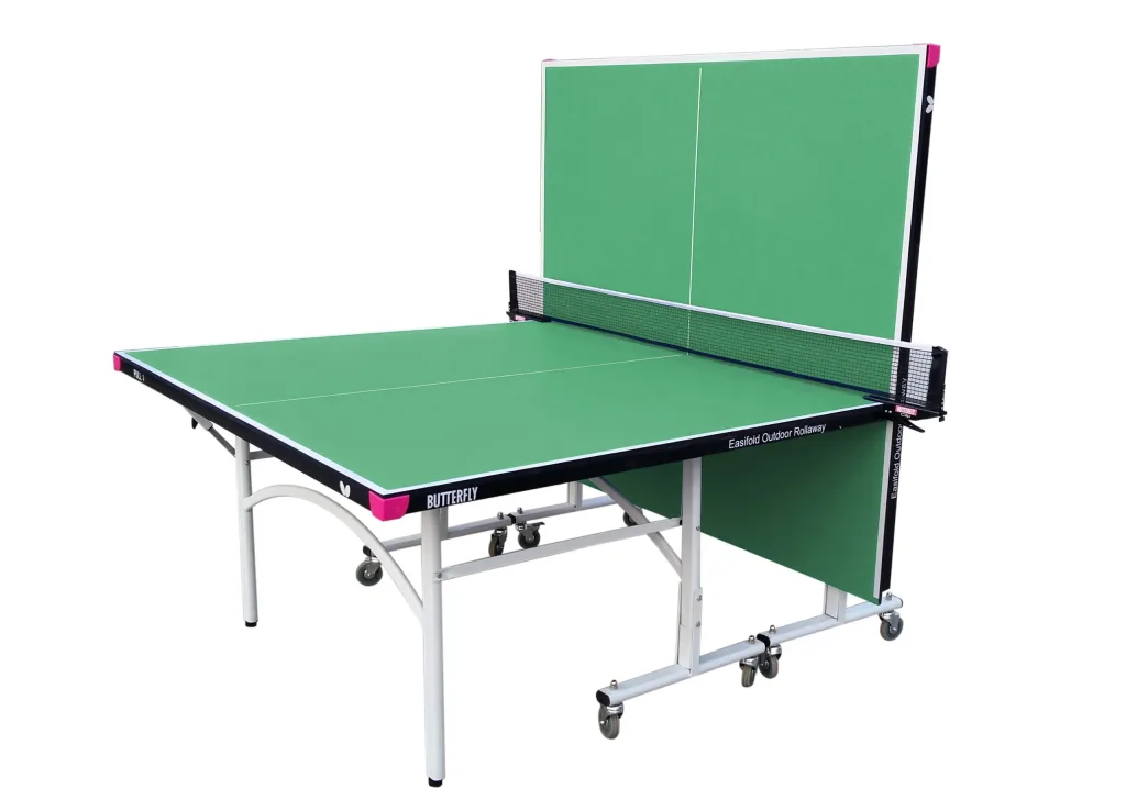 Outdoor rollaway table tennis table with green playing top and light silver legs, one half folded upright with net and caster wheels.