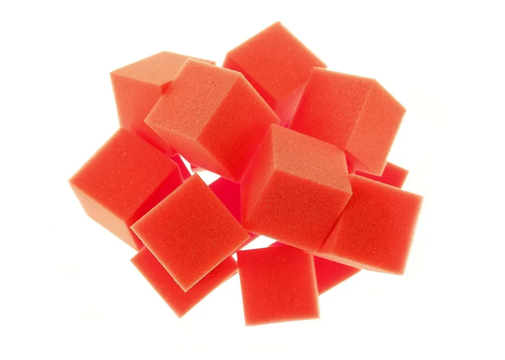 Loose pile of red foam cubes for gym pits.
