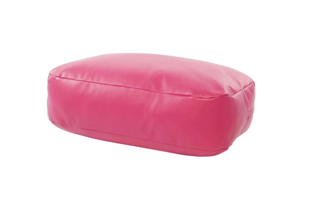 Child bean bench in pink faux leather with a rectangular rounded shape and visible seams.