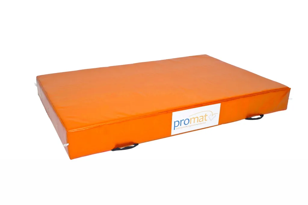 Orange PVC-covered crash mat with black carrying handles and a white label reading promat on the side.