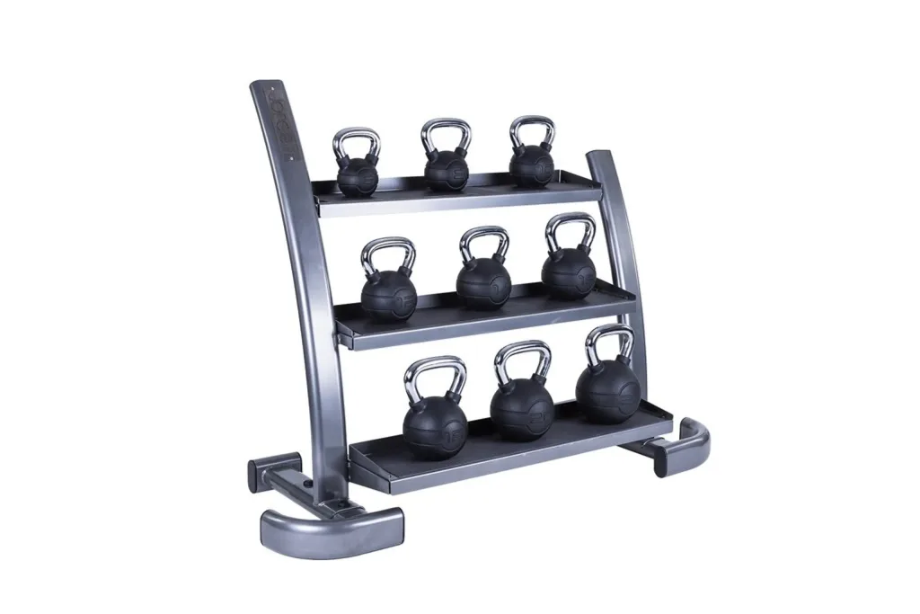 Graphite grey three-tier kettlebell rack with rubber-matted shelves holding nine black kettlebells with chrome handles.