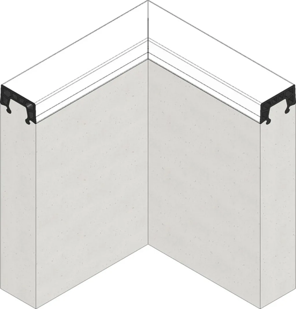 White sandpit kerbing with a black EPDM rubber-topped edge and internal air cushions forming a right-angled corner.
