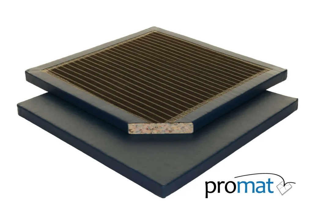 Two stacked blue PVC gym mats, top mat with ribbed black surface and cutaway showing recycled chip foam core, with 'promat' text.