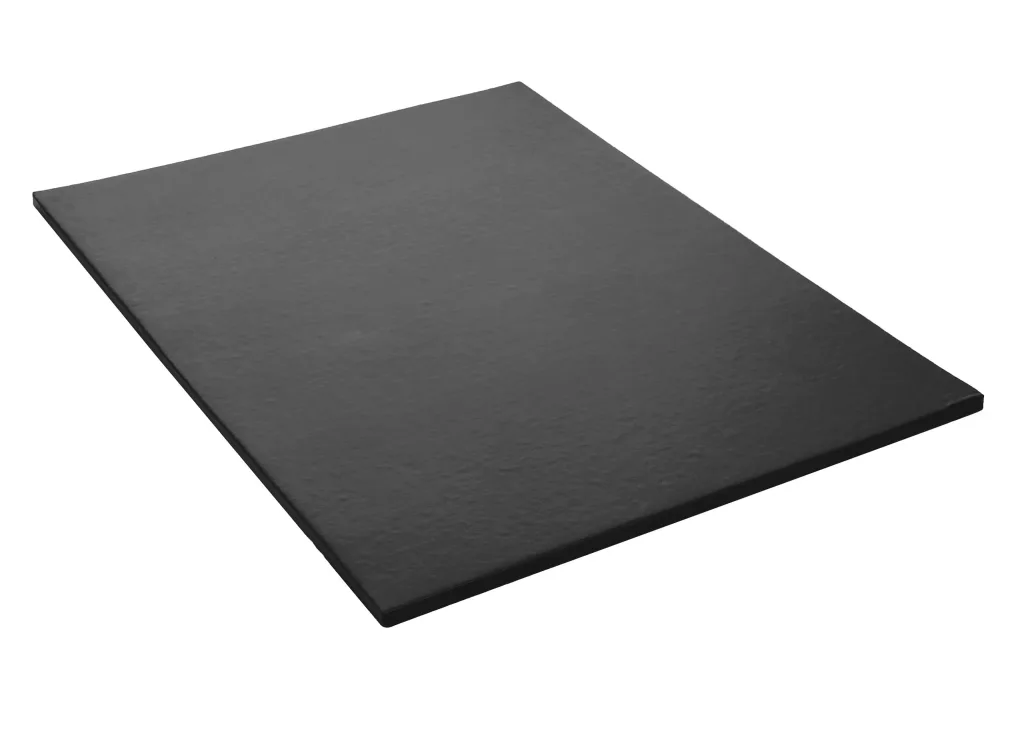 Dark rectangular gym mat with heavy-duty flame resistant PVC fabric cover and slim profile, shown angled on a white background.
