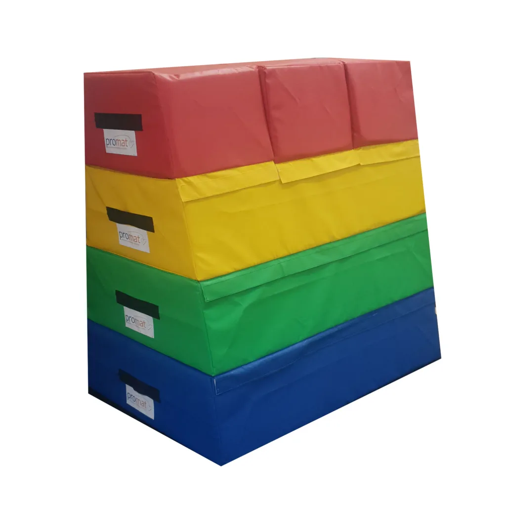 Four-section foam vaulting box with triple top and flame-retardant PVC cover in red, yellow, green and blue sections, label reads promat.