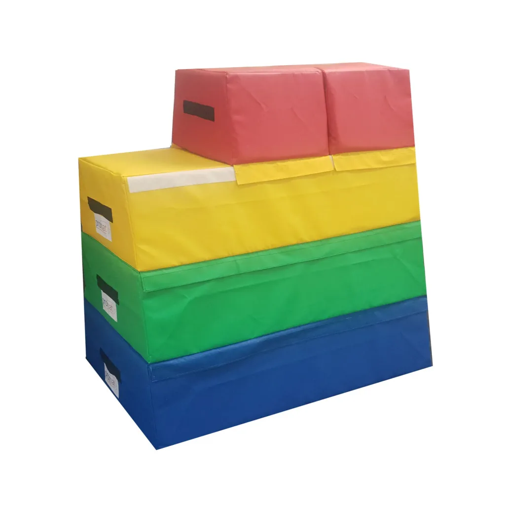 Four-section foam vaulting box with triple top in red, yellow, green and blue, high-density PU foam with flame-retardant PVC cover and handles.