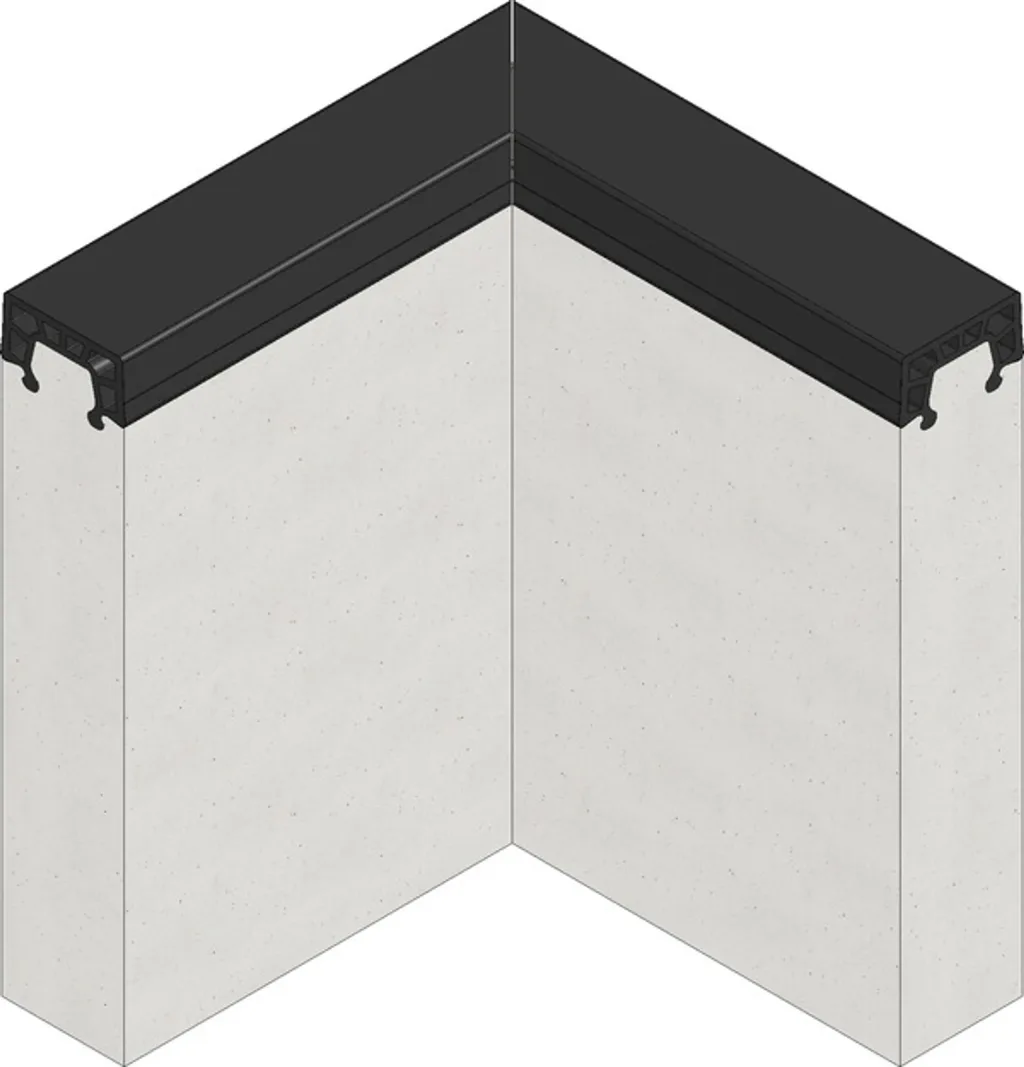 Black EPDM rubber-topped kerb with hollow air-cushion profile fitted to two pale grey sandpit walls at a right-angled corner.