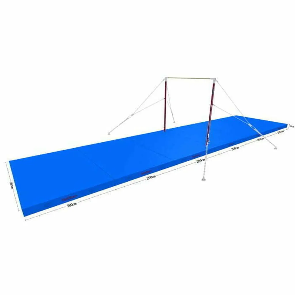 Blue sectional competition landing mat made of joined rectangular panels, placed under a balance beam with two upright supports and guy ropes.