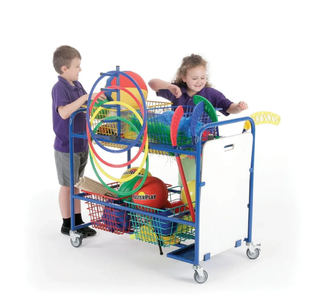 Blue organiser storage trolley with four primary-coloured wire baskets, hoop rack and white wipe-off board, two children loading sports equipment.