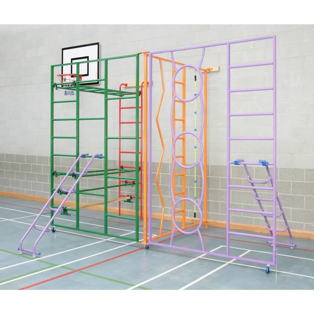 Colorful powder-coated tubular steel climbing frame with ladders, rings and foldable gate panels set against a gym wall with a basketball hoop.
