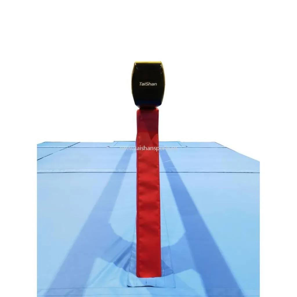 Competition carbon fibre balance beam with black padded head, red covered support column and blue landing mats.