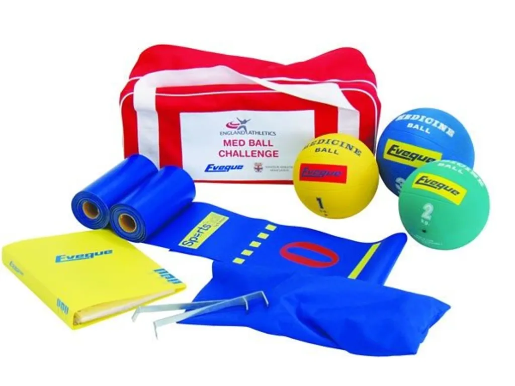 Red and white carry bag labeled Med Ball Challenge, with 1kg, 2kg and 3kg medicine balls, two blue measuring mats, pegs and yellow binder.
