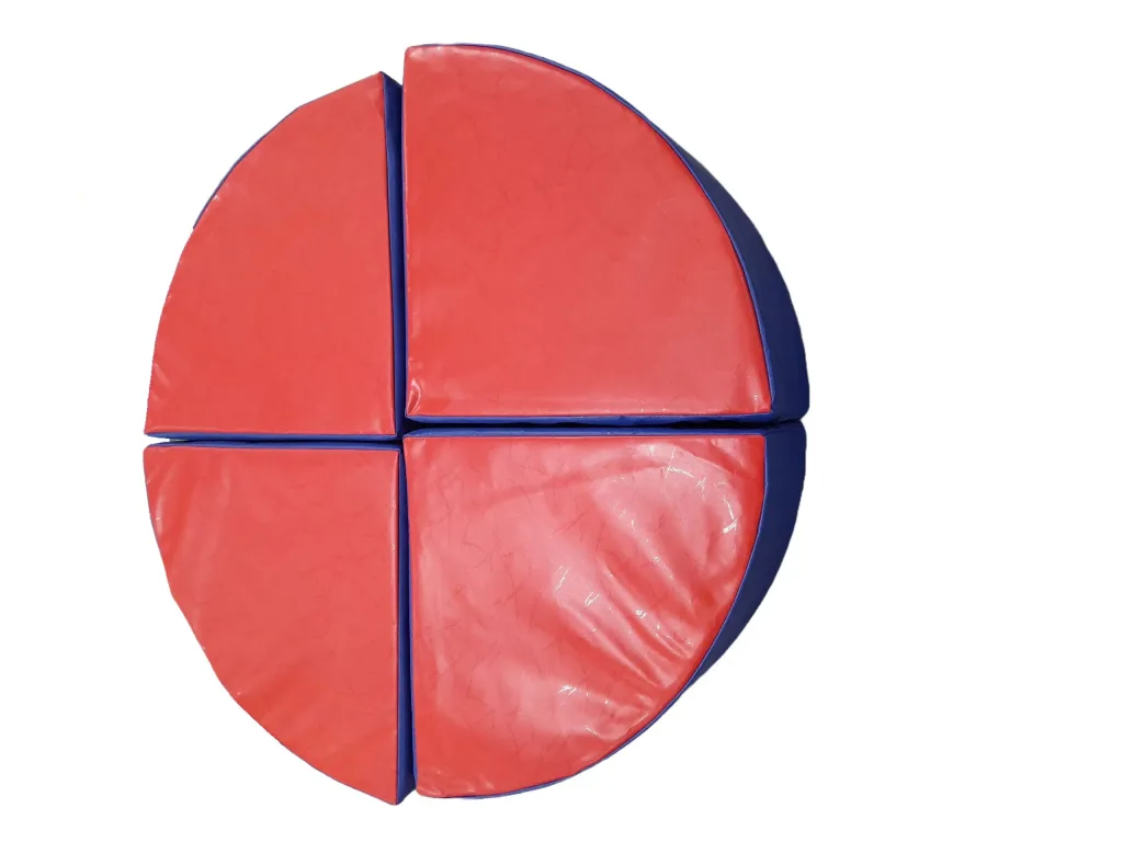 Four foam-filled children's wedge pouffe pieces with PVC covers, red tops and blue sides arranged to form a circle.