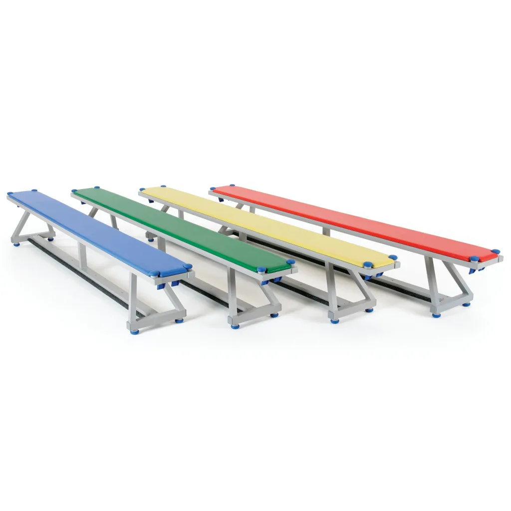 Aluminium benches with upholstered tops in blue, green, yellow and red arranged in parallel rows.