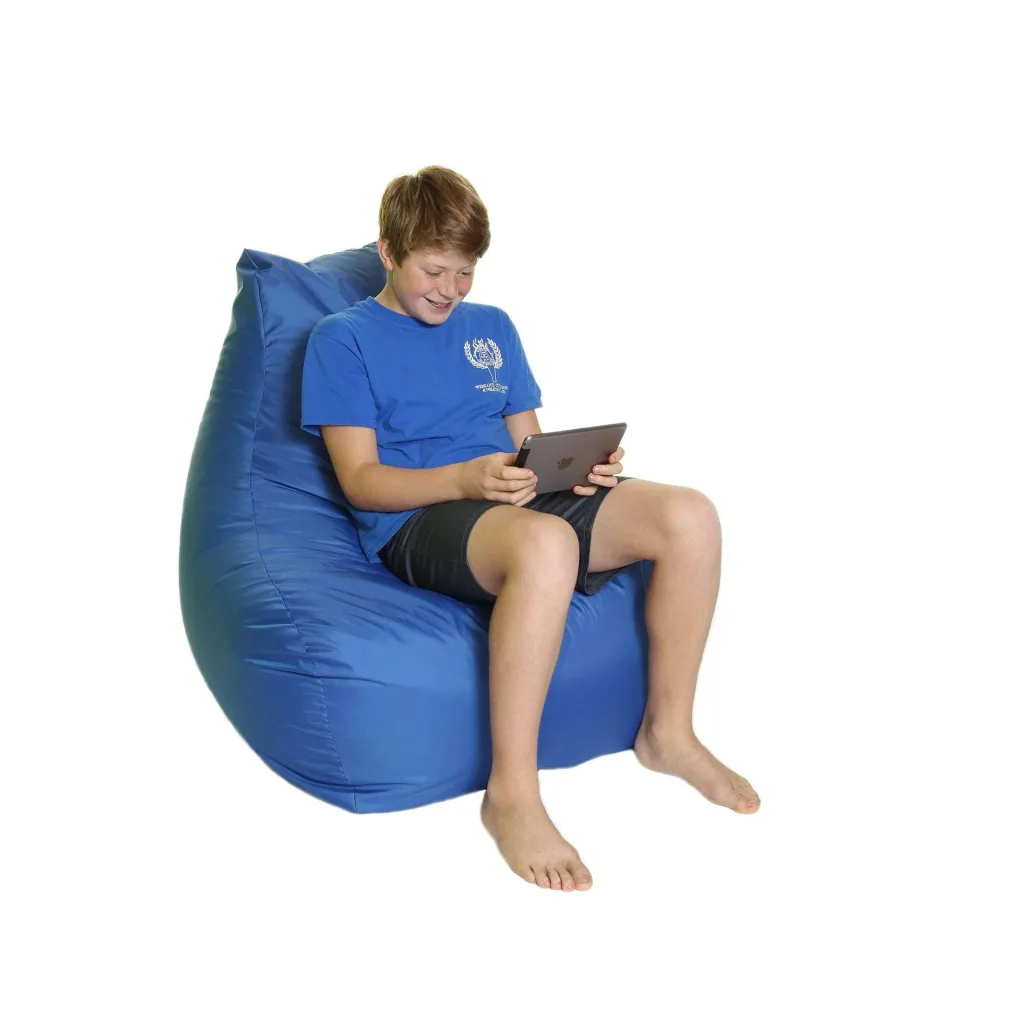 Teen sitting on a blue polyester bean chair with extended back, smiling while holding a tablet.