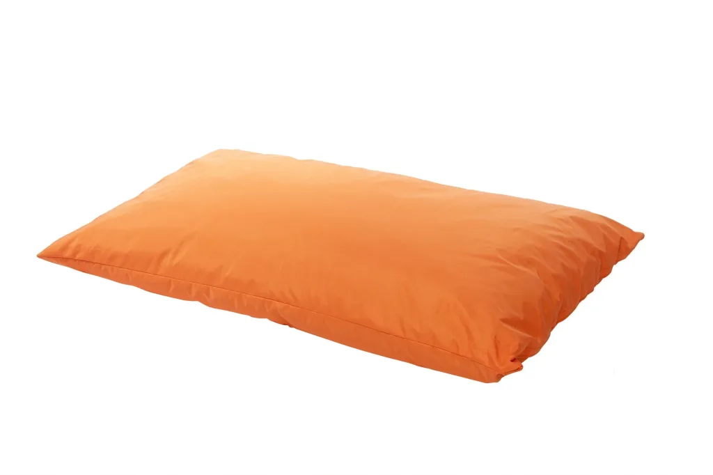 Large orange polyester floor cushion for children, low rectangular pillow-shaped seat with stitched seams on a white background.