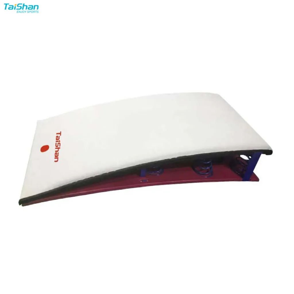 White competition springboard with "Taishan" printed on the top, birch wood base and exposed blue springs under a red frame.