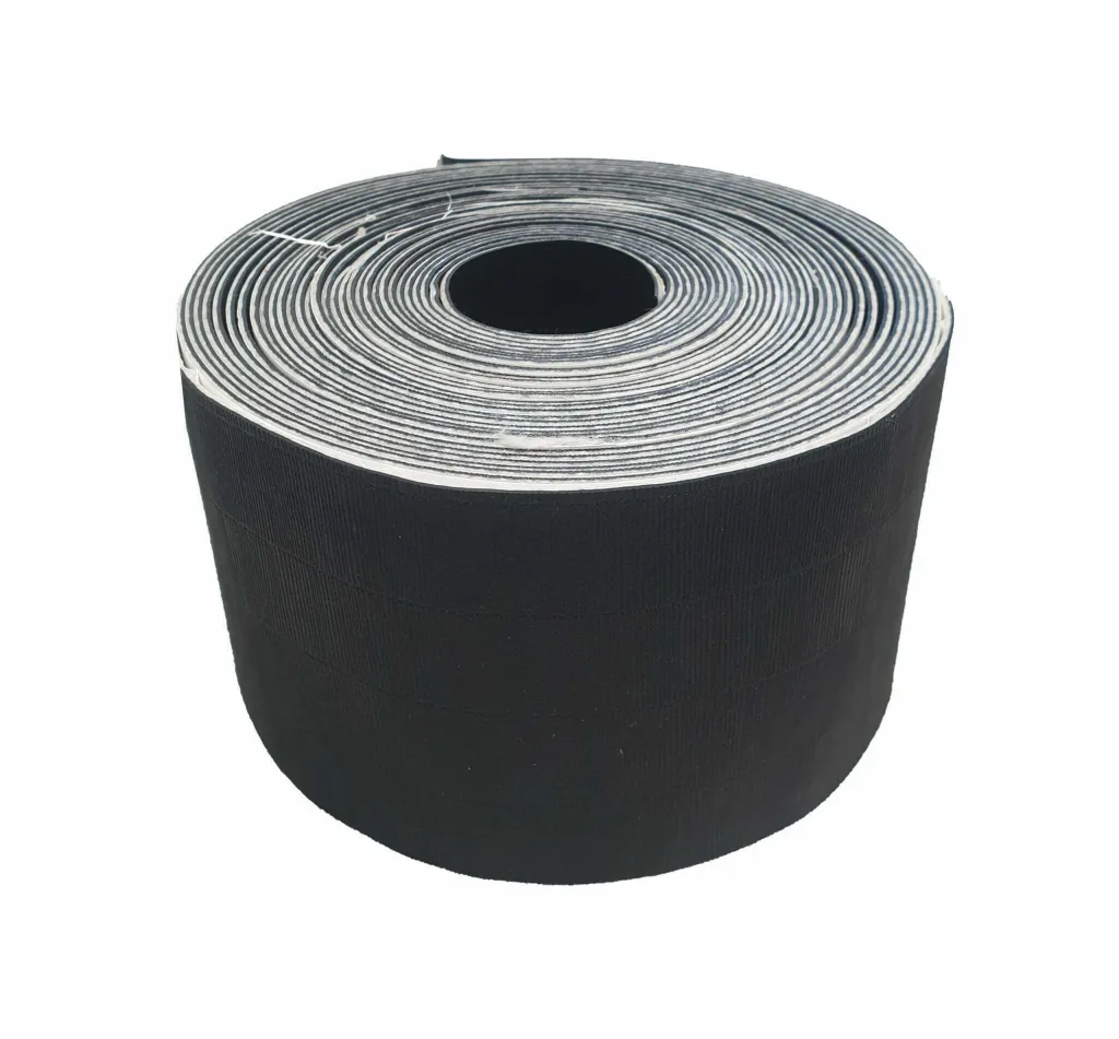 A roll of black tatami tape with a coiled white adhesive backing visible on top against a white background.