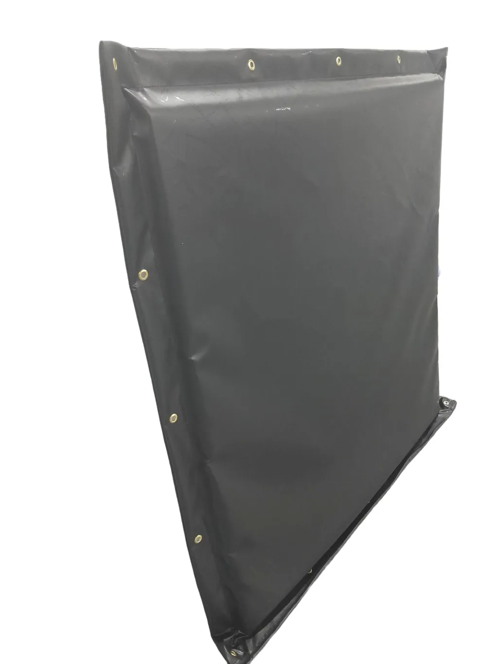 Rectangular black waterproof horse kick pad with brass eyelets along the top and side edges and a padded front surface.
