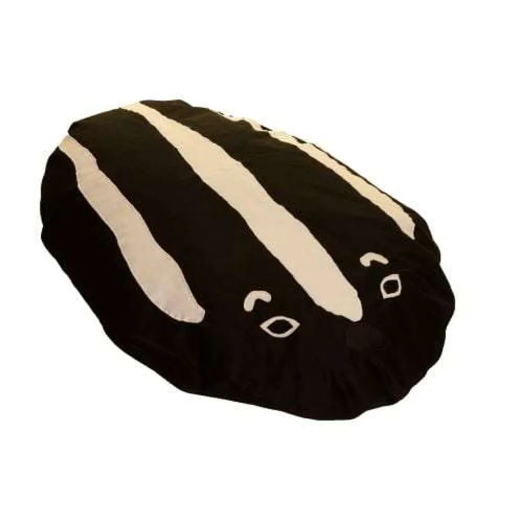 Large black animal-shaped floor cushion with three white stripes and simple stitched eyes and nose, fibre filled with a machine-washable cover.