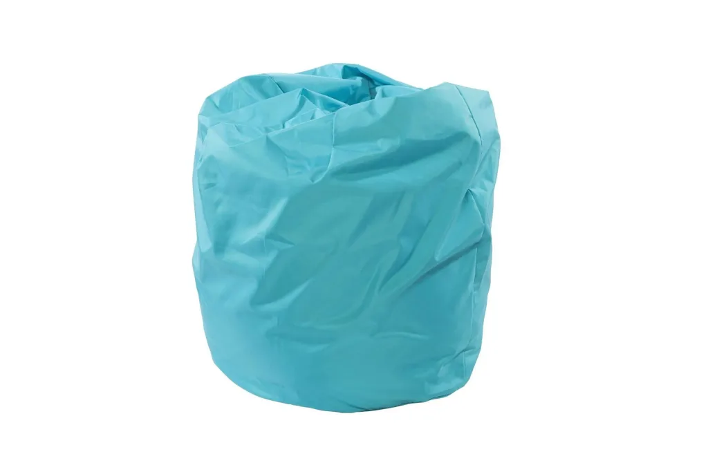 Turquoise polyester child bean bag with a crumpled, rounded shape on a plain white background.