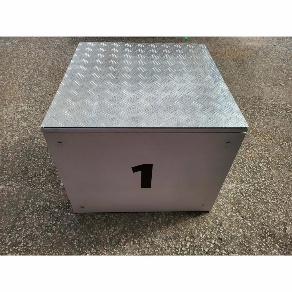 Winners podium box with chequered plate top and '1' printed on the front panel.