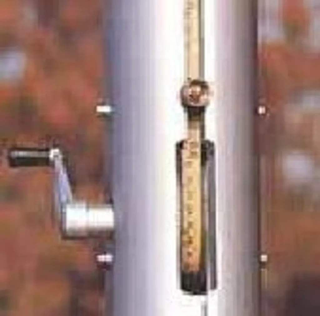 Aluminium pole vault upright showing winding handle, vertical height scale and locking mechanism.