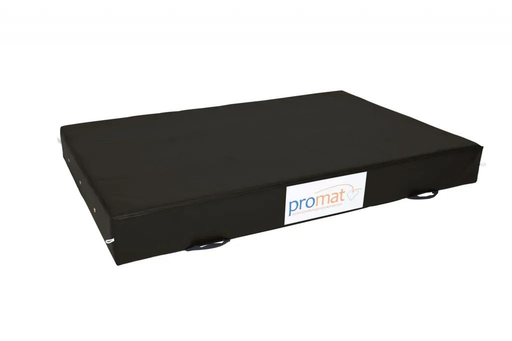 Rectangular crash mat with PU foam core and nylon-reinforced PVC zipped cover, handles and white label reading promat.
