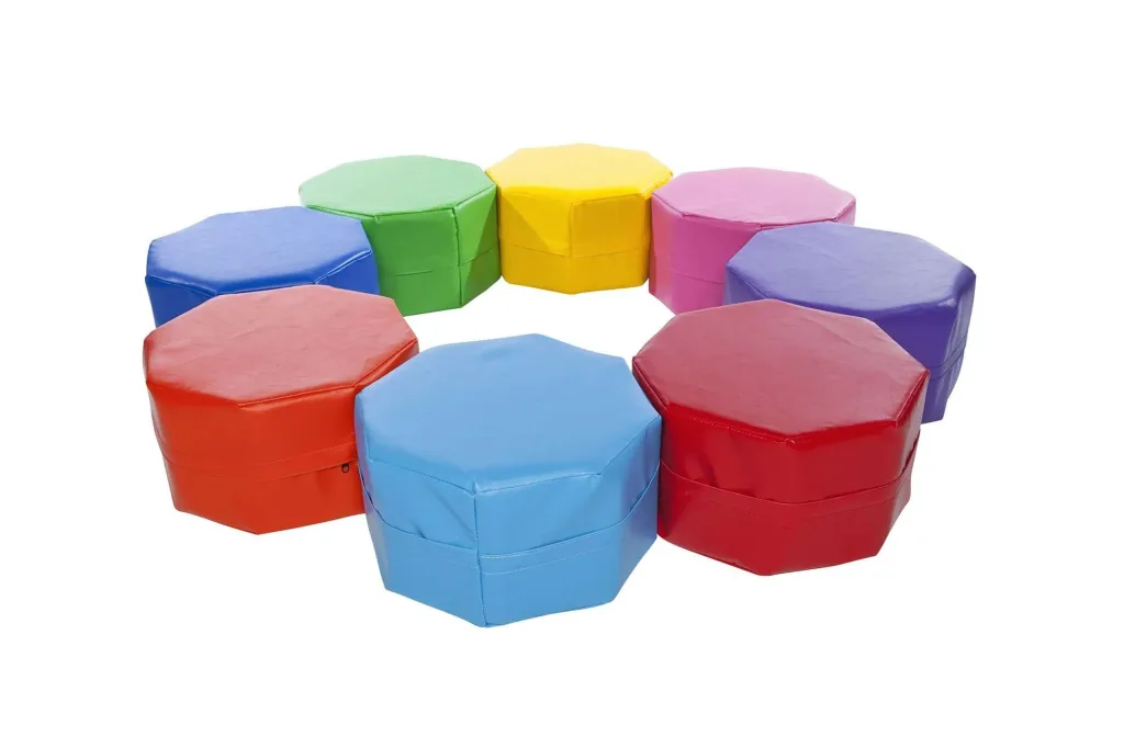 Octo seating set of eight faux leather, foam-filled seats with PVC covers in 8 random colours arranged in a circle.